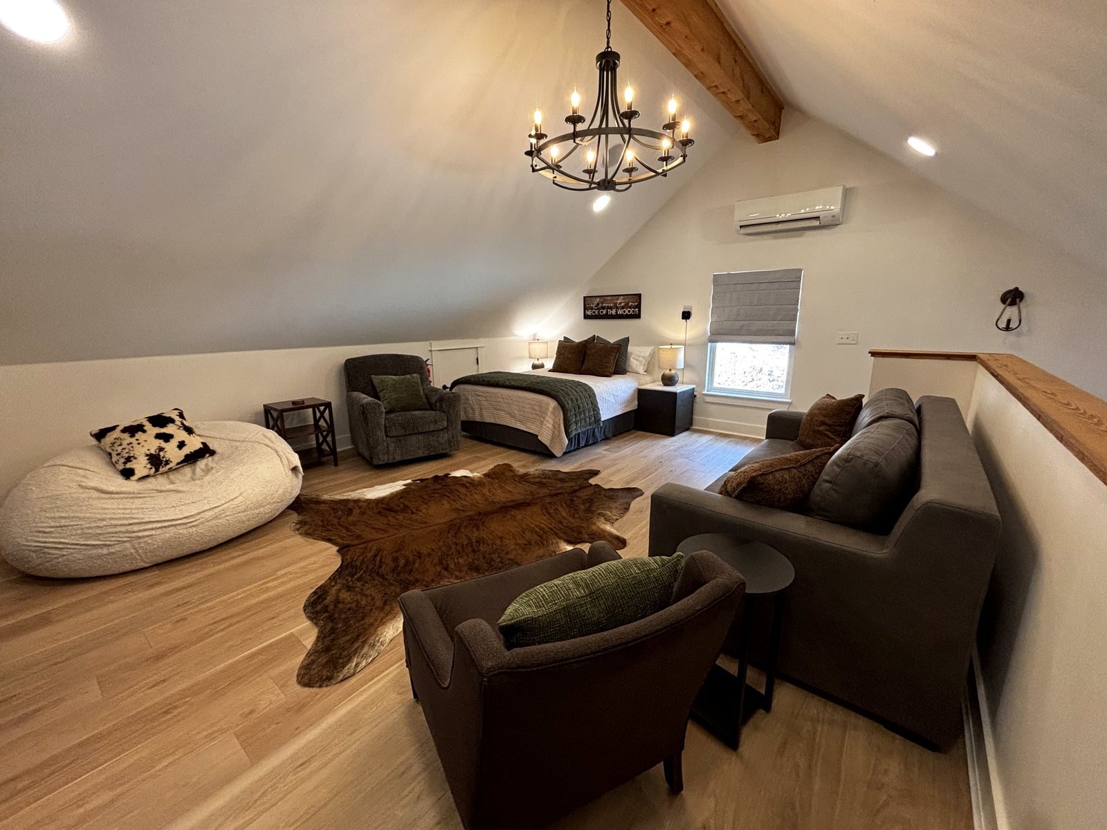 The upstairs loft under its vaulted ceiling